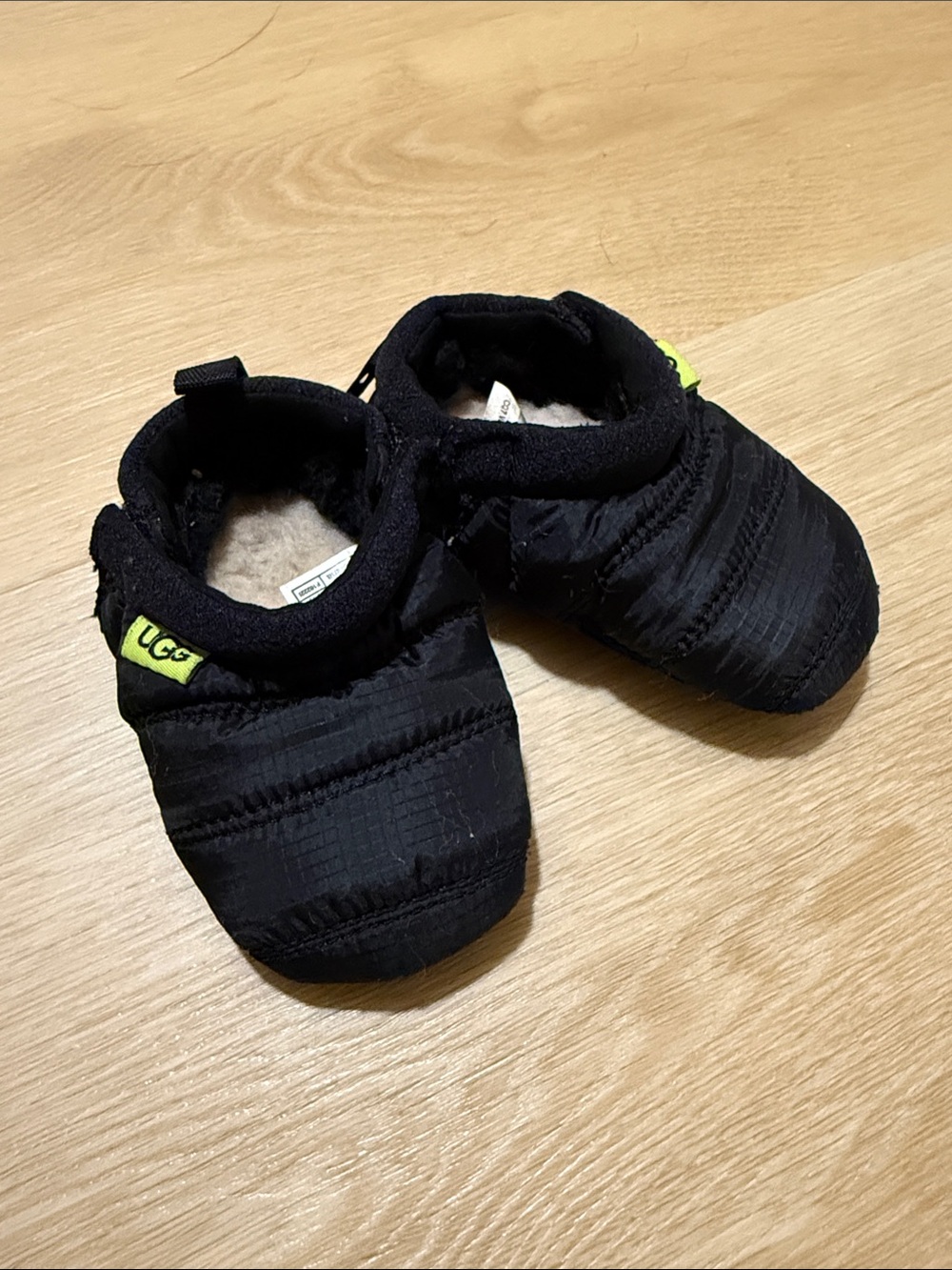 UGG Black Quilted Baby Slip-On Booties with Neon Yellow Tab